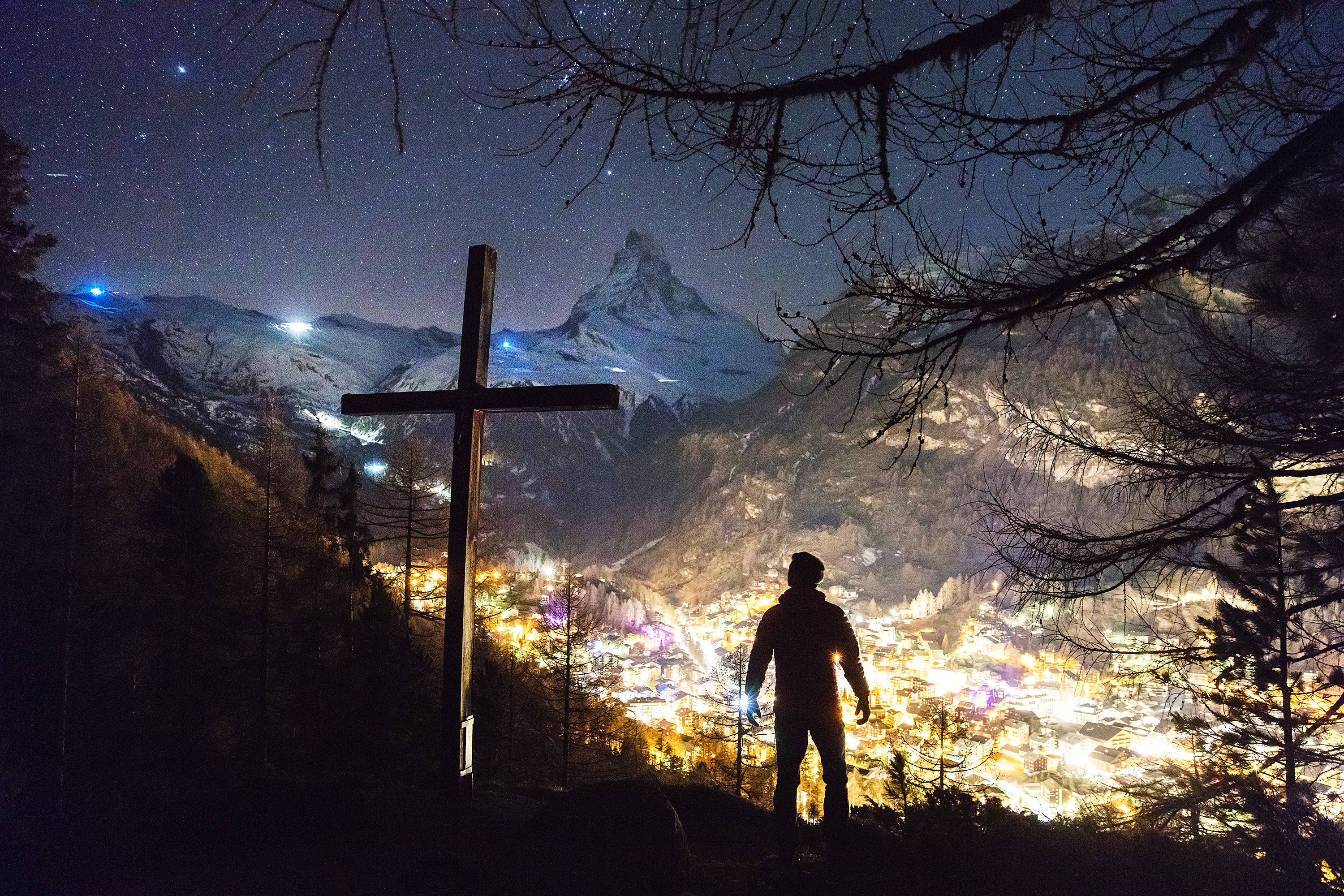 cross on mountain at night