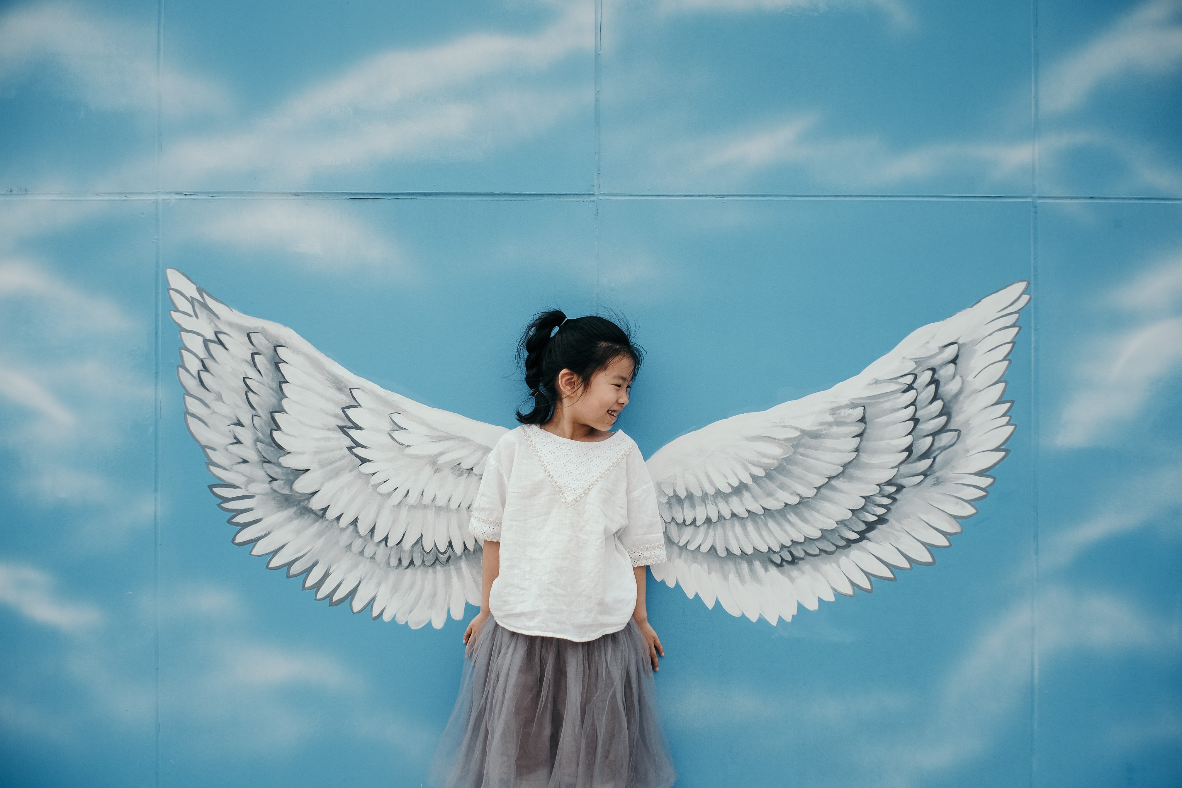 little girl with wings